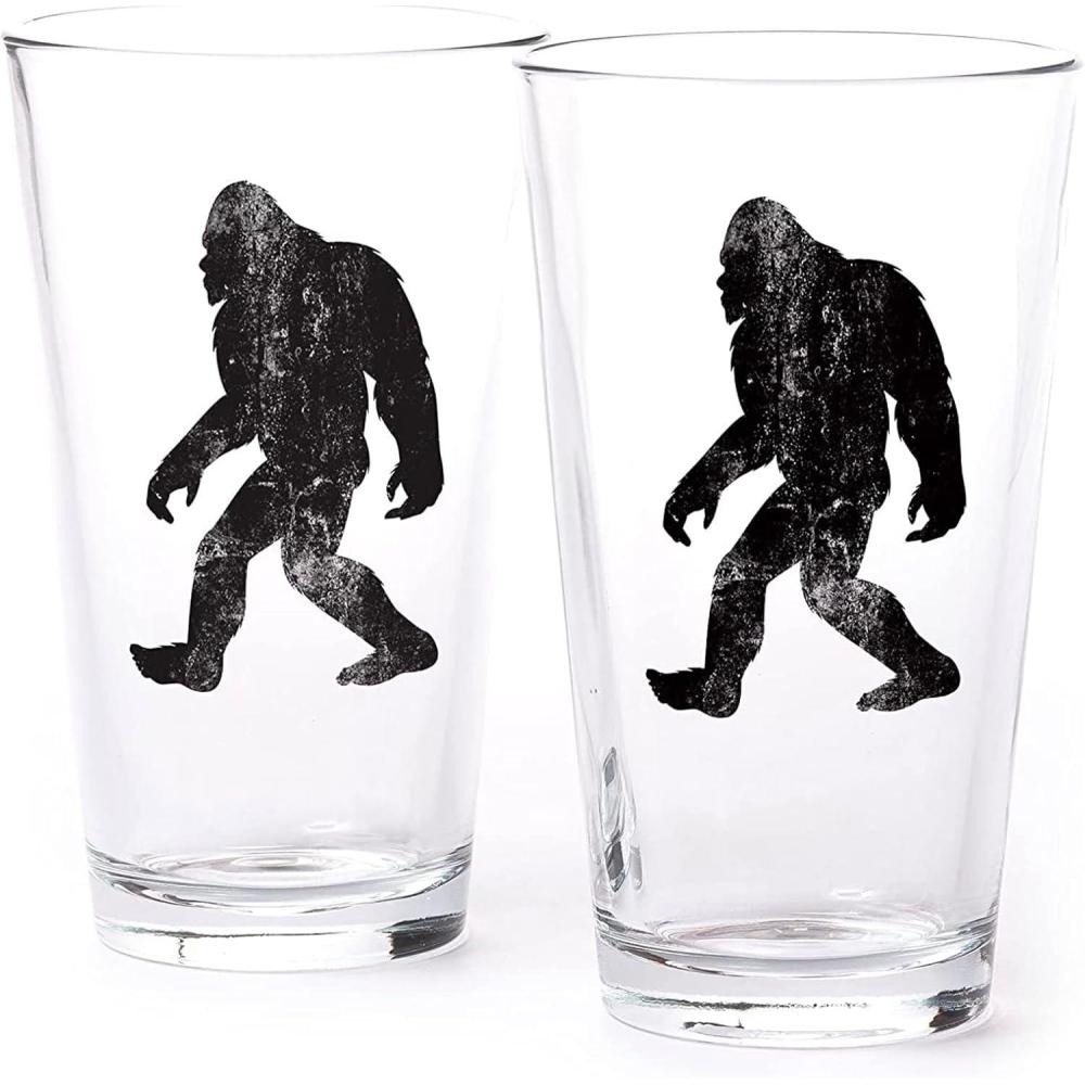 image:imagePint Glasses by Black Lantern  Beer Glasses for Craft Beer Enthusiasts  Set of Two 16oz Glasses  Bigfoot in the Forest Cocktail and Drinking Glasses  Bigfoot Lover GiftsRustic Bigfoot